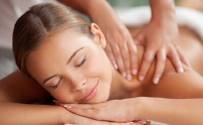 Therapist applying essential oils during a relaxing aroma oil massage.